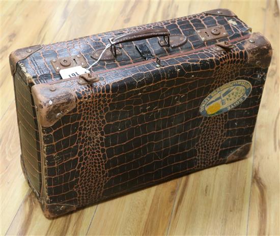 A faux crocodile suitcase